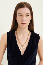 Load image into Gallery viewer, GULNOZA DILNOZA Logo pendant necklace in gold finish metal