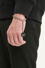 Load image into Gallery viewer, GULNOZA DILNOZA Logo pendant bracelet in silver finish metal