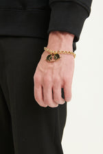 Load image into Gallery viewer, GULNOZA DILNOZA Logo pendant bracelet in gold finish metal