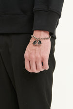 Load image into Gallery viewer, GULNOZA DILNOZA Logo pendant bracelet in silver finish metal
