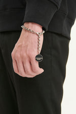 Load image into Gallery viewer, GULNOZA DILNOZA Logo pendant bracelet in silver finish metal
